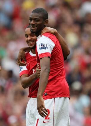 Arsenal s Theo Walcott (L) celebrates with goalscorer Abou Diaby Barclays Premier League Arsenal London (red) v Blackpool FC (white) 21st August, 2010 EDITORIAL USE ONLY. No use with unauthorised audio, video, data, fixture lists, club league logos or live services. Online in-match use limited to 120 images, no video emulation. No use in betting, games or single club league player publications.