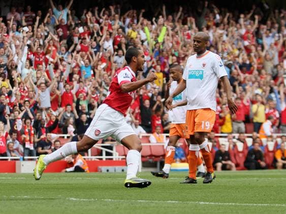 Arsenal s Theo Walcott celebrates scoring his sides opening goal Barclays Premier League Arsenal London (red) v Blackpool FC (white) 21st August, 2010 EDITORIAL USE ONLY. No use with unauthorised audio, video, data, fixture lists, club league logos or live services. Online in-match use limited to 120 images, no video emulation. No use in betting, games or single club league player publications. o0 Jubel Freude