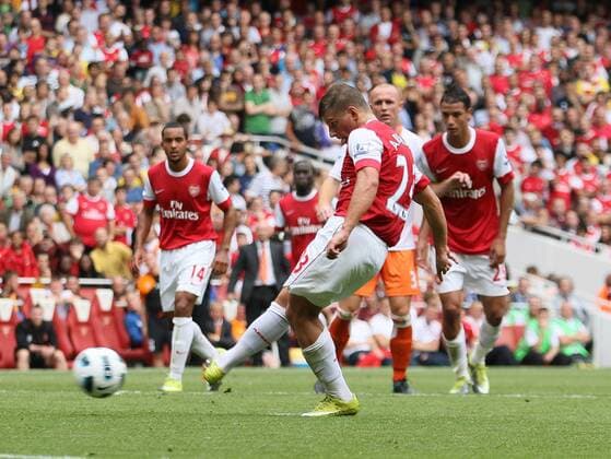 Arsenal s Anderi Arshavin scoring his sides second goal Barclays Premier League Arsenal London (red) v Blackpool FC (white) 21st August, 2010 EDITORIAL USE ONLY. No use with unauthorised audio, video, data, fixture lists, club league logos or live services. Online in-match use limited to 120 images, no video emulation. No use in betting, games or single club league player publications.