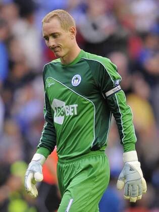 Chris Kirkland of Wigan Athletic dejected Barclays Premier League Wigan Athletic v Chelsea FC London 21st August, 2010 EDITORIAL USE ONLY. No use with unauthorised audio, video, data, fixture lists, club league logos or live services. Online in-match use limited to 120 images, no video emulation. No use in betting, games or single club league player publications. o0 Enttäuschung,
