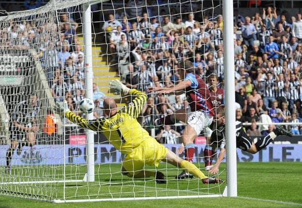 Newcastle s Kevin Nolan (R) scores his side s second goal against goalkeeper Brad Friedel - Barclays Premier League Newcastle United v Aston Villa 22nd August, 2010 EDITORIAL USE ONLY. No use with unauthorised audio, video, data, fixture lists, club league logos or live services. Online in-match use limited to 120 images, no video emulation. No use in betting, games or single club league player publications.