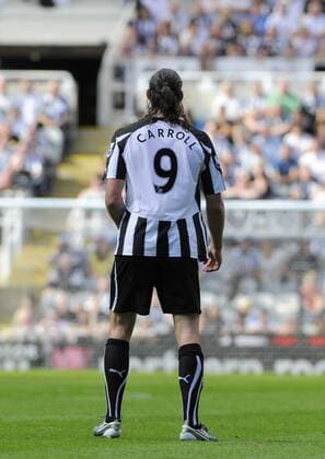 Newcastle s Andy Carroll wearing the famous number nine shirt. - Barclays Premier League Newcastle United (black) v Aston Villa (red) 22nd August, 2010 EDITORIAL USE ONLY. No use with unauthorised audio, video, data, fixture lists, club league logos or live services. Online in-match use limited to 120 images, no video emulation. No use in betting, games or single club league player publications.