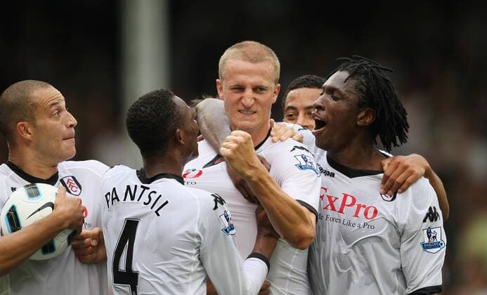 Fulham s Brede Hangeland (C) celebrates his late goal - Barclays Premier League Fulham FC (white) v Manchester United ManU (red) 22nd August, 2010 EDITORIAL USE ONLY. No use with unauthorised audio, video, data, fixture lists, club league logos or live services. Online in-match use limited to 120 images, no video emulation. No use in betting, games or single club league player publications.