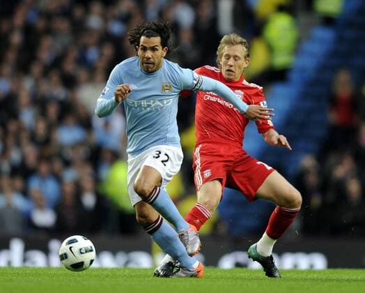 Carlos Tevez (L) of Manchester City and Lucas of Liverpool FC Barclays Premier League Manchester City v Liverpool 23rd August, 2010 EDITORIAL USE ONLY. No use with unauthorised audio, video, data, fixture lists, club league logos or live services. Online in-match use limited to 120 images, no video emulation. No use in betting, games or single club league player publications.