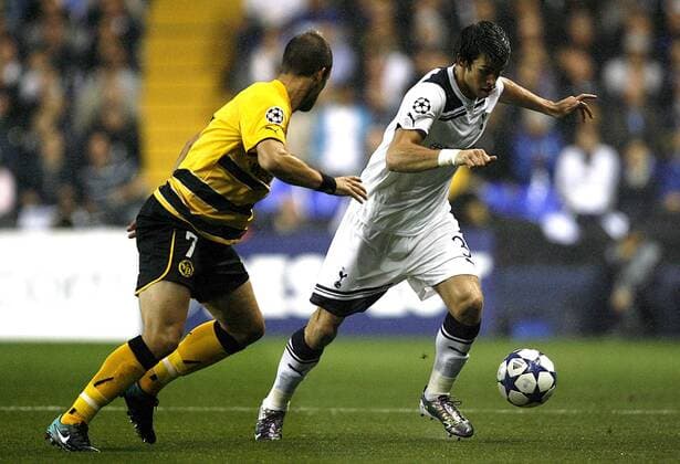 Gareth Bale of Tottenham Hotspur (R) takes on Scott Sutter of Young Boys Bern, UEFA Champions League Qualifying Tottenham Hotspur v Young Boys Bern 25th August, 2010 EDITORIAL USE ONLY. No use with unauthorised audio, video, data, fixture lists, club league logos or live services. Online in-match use limited to 120 images, no video emulation. No use in betting, games or single club league player publications.