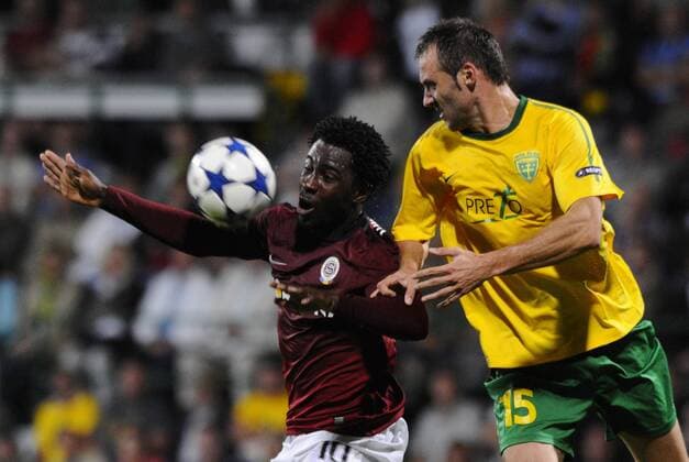 Jozef Piacek, right, of MSK Zilina and Bony Wilfried, left, of Sparta Praha fight for the ball during the Champions League qualifying play-off match MSK Zilina - Sparta Praha in Zilina Tuesday, Aug. 25, 2010. (CTKxPhoto MarianxPeiger)  CTKPhoto77201008250927801