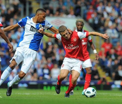 Jack Wilshere of Arsenal tussles with Steven N Zonzi of Blackburn Rovers - Barclays Premier League - Blackburn Rovers v FC Arsenal (red) 28th August, 2010 EDITORIAL USE ONLY. No use with unauthorised audio, video, data, fixture lists, club league logos or live services. Online in-match use limited to 120 images, no video emulation. No use in betting, games or single club league player publications.
