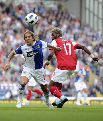 Michael Salgado of Blackburn Rovers gets past Alexandre Song of Arsenal - Barclays Premier League - Blackburn Rovers v FC Arsenal (red) 28th August, 2010 EDITORIAL USE ONLY. No use with unauthorised audio, video, data, fixture lists, club league logos or live services. Online in-match use limited to 120 images, no video emulation. No use in betting, games or single club league player publications.