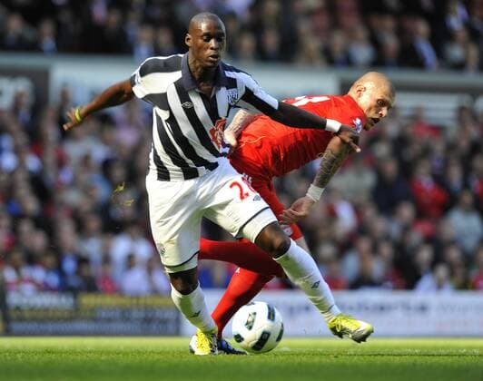 Marco Fortune (L) of West Bromwich Albion turns Martin Skrtel of Liverpool Barclays Premier League - Liverpool FC vs. West Bromwich Albion - 29th August, 2010 EDITORIAL USE ONLY. No use with unauthorised audio, video, data, fixture lists, club league logos or live services. Online in-match use limited to 120 images, no video emulation. No use in betting, games or single club league player publications.