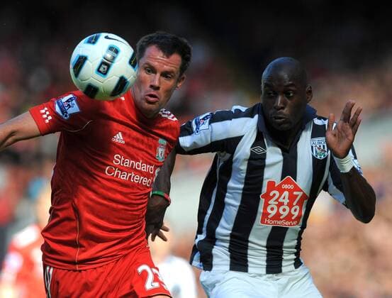 Jamie Carragher (L) of Liverpool challenged by Marco Fortune of West Bromwich Albion Barclays Premier League - Liverpool FC vs. West Bromwich Albion - 29th August, 2010 EDITORIAL USE ONLY. No use with unauthorised audio, video, data, fixture lists, club league logos or live services. Online in-match use limited to 120 images, no video emulation. No use in betting, games or single club league player publications.