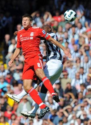 Steven Gerrard (L) of Liverpool jumps for the ball with Youssuf Mulumbu of West Bromwich Albion Barclays Premier League - Liverpool FC vs. West Bromwich Albion - 29th August, 2010 EDITORIAL USE ONLY. No use with unauthorised audio, video, data, fixture lists, club league logos or live services. Online in-match use limited to 120 images, no video emulation. No use in betting, games or single club league player publications.