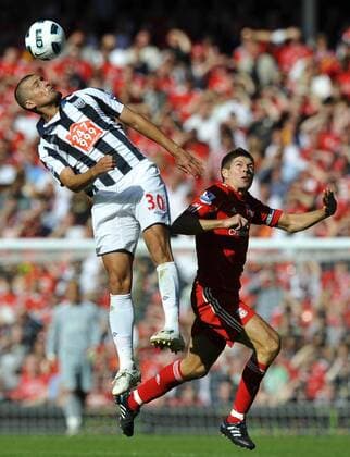 Gabriel Tamas (L) of West Bromwich Albion rises above Steven Gerrard of Liverpool Barclays Premier League - Liverpool FC vs. West Bromwich Albion 29th August, 2010 EDITORIAL USE ONLY. No use with unauthorised audio, video, data, fixture lists, club league logos or live services. Online in-match use limited to 120 images, no video emulation. No use in betting, games or single club league player publications.