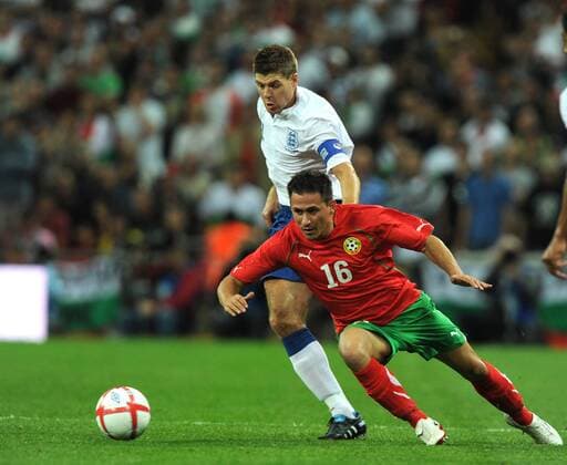 Steven Gerrard of England tussles with Zhivko Milanov of Bulgaria, England (white) - Bulgaria (red) EDITORIAL USE ONLY. No use with unauthorised audio, video, data, fixture lists, club league logos or live services. Online in-match use limited to 120 images, no video emulation. No use in betting, games or single club league player publications.