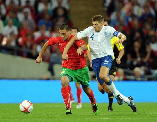 Ivelin Popov of Bulgaria and Steven Gerrard of England, England (white) - Bulgaria (red) EDITORIAL USE ONLY. No use with unauthorised audio, video, data, fixture lists, club league logos or live services. Online in-match use limited to 120 images, no video emulation. No use in betting, games or single club league player publications.