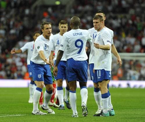 Jermaine Defoe (C) of England receives his fellow team mates James Milner (R) and Phil Jagielka (L) accolades after scoring his hatrick goal European Championship Qualifying Group G England v Bulgaria 3rd September, 2010 EDITORIAL USE ONLY. No use with unauthorised audio, video, data, fixture lists, club league logos or live services. Online in-match use limited to 120 images, no video emulation. No use in betting, games or single club league player publications. o0 Jubel, Freude
