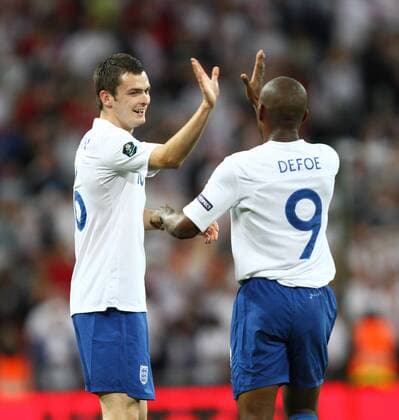 England (white) v Bulgaria (red) . . 03.09.10: Adam Johnson (L) celebrates scoring a goal for England (3-0) with Jermain Defoe. 