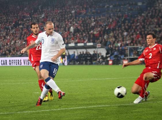 England s Wayne Rooney (2L) scoring his sides opening goal European Championship Qualifying Group G Switzerland v England 7th September, 2010 EDITORIAL USE ONLY. No use with unauthorised audio, video, data, fixture lists, club league logos or live services. Online in-match use limited to 120 images, no video emulation. No use in betting, games or single club league player publications.