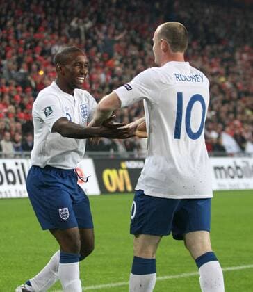 England s Wayne Rooney celebrates scoring his sides opening goal with Jermain Defoe European Championship Qualifying Group G Switzerland v England 7th September, 2010 EDITORIAL USE ONLY. No use with unauthorised audio, video, data, fixture lists, club league logos or live services. Online in-match use limited to 120 images, no video emulation. No use in betting, games or single club league player publications.