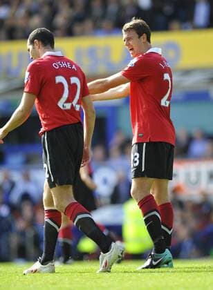 Jonny Evans (R) of Manchester United shouts at John O Shea of Manchester United after the second Everton goal - Barclays Premier League, FC Everton vs. Manchester United 11th September, 2010 EDITORIAL USE ONLY. No use with unauthorised audio, video, data, fixture lists, club league logos or live services. Online in-match use limited to 120 images, no video emulation. No use in betting, games or single club league player publications. o0 Liverpool Manu Oshea