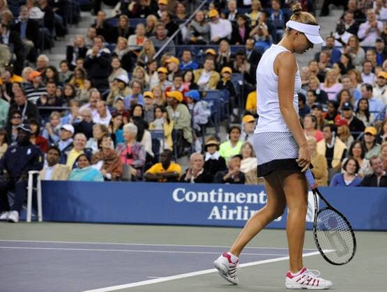 Vera Zvonareva of Russia reacts during the women s singles final at the U.S. Open tennis tournament in New York, the United States, Sept. 11, 2010. 