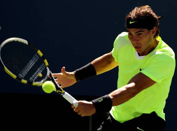 Rafael Nadal of Spain hits a return during the men s singles semifinal at the U.S. Open tennis tournament in New York, the United States, Sept. 11, 2010. 