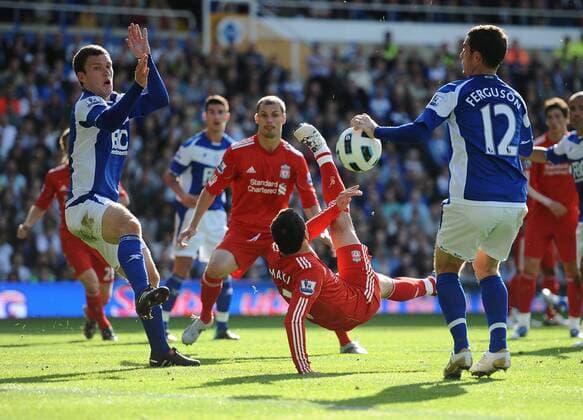 Football - Barclays Premiership - Birmingham City vs. FC Liverpool Liverpool s Maxi Rodriguez (C) attempt an overhead shot on goal at St Andrews, Birmingham  o0 Maximiliano