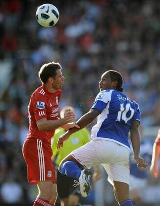 Football - Barclays Premiership - Birmingham City vs. FC Liverpool Birmingham City s Cameron Jerome and Liverpool s Jamie Carragher in action at St Andrews, Birmingham 