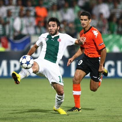UEFA Champions League group C match between Bursaspor and FC Valencia at Ataturk Stadium in Bursa 15.09.2010 Valencia won scored 4 - 0 Pictured: Volkan Sen (front) of Bursaspor and Ricardo Costa (back) of Valencia. 