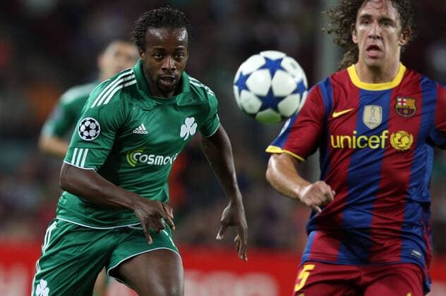 14.09.2010, Barcelona - UEFA Champions League 2010 2011 - FC Barcelona (red stripes) vs Panathinaikos Athens (green) 5:1 --- Panathinaikos Sydney Govou and Carles Puyol of Barca 