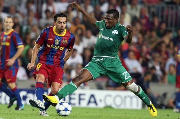 14.09.2010, Barcelona - UEFA Champions League 2010 2011 - FC Barcelona (red stripes) vs Panathinaikos Athens (green) 5:1 --- Xavi Hernandez and Panathinaikos Simao 