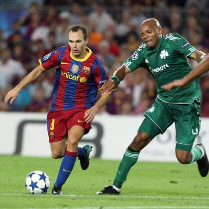 14.09.2010, Barcelona - UEFA Champions League 2010 2011 - FC Barcelona (red stripes) vs Panathinaikos Athens (green) 5:1 --- Andres Iniesta of Barca and Panathinaikos Jean-Alain Boumsong 