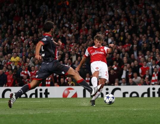 Arsenal s Andrey Arshavin scoring his sides second goal --- UEFA Champions League - Group H - FC Arsenal London (red) vs SC Sporting Braga (black), 15th September, 2010 EDITORIAL USE ONLY. No use with unauthorised audio, video, data, fixture lists, club league logos or live services. Online in-match use limited to 120 images, no video emulation. No use in betting, games or single club league player publications. o0 Tor