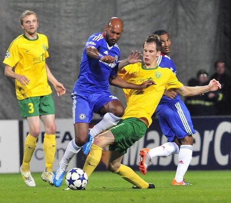 Chelsea FC London s Nicolas Anelka (middle in blue) fights for the ball with Zilina s Mario Pecalka during the Champions League Group F soccer match between MSK Zilina and Chelsea FC London in Zilina, Slovakia, on Wednesday, Sept. 15, 2010. Patrik Mraz of Zilina pictured left. (CTKxPhoto JaroslavxPodhorsky)  CTKPhoto7201009150998701