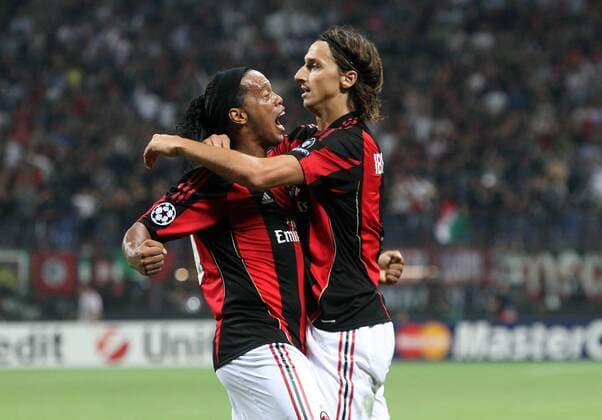 Celebration of ZLATAN IBRAHIMOVIC (R) after scoring with RONALDINHO --- AC Milan (red stripes) vs AJ Auxerre (blue) 2:0 --- ALBERTOXCAMICI o0 Jubel Freude