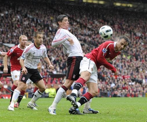 Dimitar Berbatov (R) of Manchester United beats Fernando Torres (2.R) of Liverpool to head the first goal Premier League - Manchester United vs. Liverpool FC 19th September, 2010 EDITORIAL USE ONLY. No use with unauthorised audio, video, data, fixture lists, club league logos or live services. Online in-match use limited to 120 images, no video emulation. No use in betting, games or single club league player publications.
