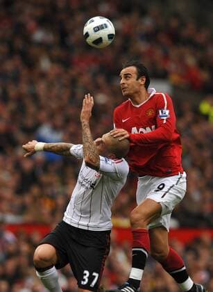 Dimitar Berbatov (R) of Manchester United rises above Martin Skrtel of Liverpool Premier League - Manchester United vs. Liverpool FC 19th September, 2010 EDITORIAL USE ONLY. No use with unauthorised audio, video, data, fixture lists, club league logos or live services. Online in-match use limited to 120 images, no video emulation. No use in betting, games or single club league player publications.