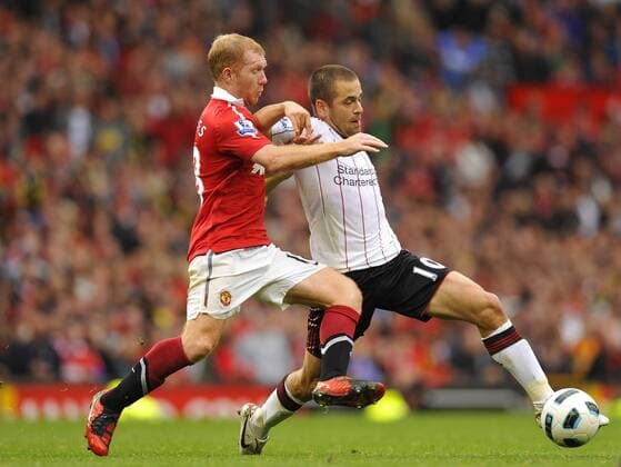 Paul Scholes l. of Manchester United tackles Joe Cole of Liverpool FC Barclays Premier League Manchester United Manu v Liverpool FC 19th September, 2010 EDITORIAL USE ONLY. No use with unauthorised audio, video, data, fixture lists, club league logos or live services. Online in-match use limited to 120 images, no video emulation. No use in betting, games or single club league player publications.