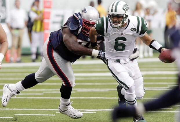 New York Jets Mark Sanchez breaks free from New England Patriots Vince Wilfork in the second quarter in week 2 of the NFL season at New Meadowlands Stadium in East Rutherford, New Jersey on September 19, 2010. The Jets defeated the Patriots 28-14.  NYP20100919106