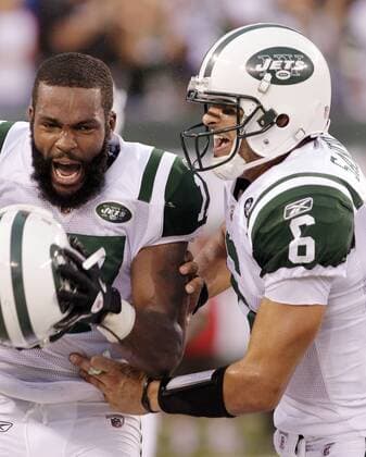 New York Jets Mark Sanchez and Braylon Edwards react after a successful 2-point conversion in the third quarter against the New England Patriots in week 2 of the NFL season at New Meadowlands Stadium in East Rutherford, New Jersey on September 19, 2010. The Jets defeated the Patriots 28-14.  NYP20100919116