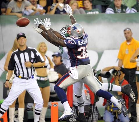 19 September 2010: New York Jets wide receiver Jerricho Cotchery (89) is defended by New England Patriots cornerback Devin McCourty (32) during the second half the New England Patriots vs New York Jets game at the New Meadowlands Stadium in East Rutherford, New Jersey The Jets beat the Patriots 28-14 Icon781100919076 EDITORIAL USE ONLY