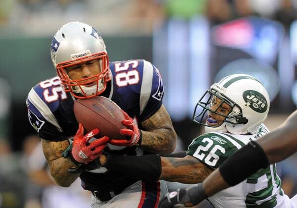 19 September 2010: New England Patriots tight end Aaron Hernandez (85) makes a catch over the middle as New York Jets cornerback Dwight Lowery (26) defends during the first half the New England Patriots vs New York Jets game at the New Meadowlands Stadium in East Rutherford, New Jersey Icon781100919068 EDITORIAL USE ONLY