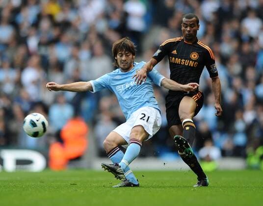 Football - Barclays Premiership - Manchester City (blue) vs. FC Chelsea (black) --- Manchester City s David Silva and FC Chelsea s Ashley Cole in action at the City of Manchester Stadium, Manchester 