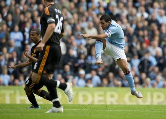 Carlos Tevez of Manchester City scores the first goal Barclays Premier League Manchester City v FC Chelsea 25th September, 2010 EDITORIAL USE ONLY. No use with unauthorised audio, video, data, fixture lists, club league logos or live services. Online in-match use limited to 120 images, no video emulation. No use in betting, games or single club league player publications.
