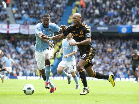 Kolo Toure of Manchester City (L) tackles Nicolas Anelka of Chelsea - Premier League - Manchester City - Chelsea FC London 1:0 - 2010 EDITORIAL USE ONLY. No use with unauthorised audio, video, data, fixture lists, club league logos or live services. Online in-match use limited to 120 images, no video emulation. No use in betting, games or single club league player publications.
