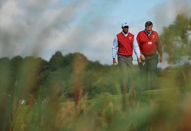 Golf - Ryder Cup 2010 - Practice Day 1: Tiger Woods of the USA (L) in action at Celtic Manor, Newport  RyderCup