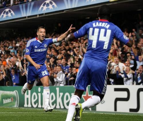 Chelsea s John Terry celebrates (L) scoring his sides opening goal - Champions League Group F - Chelsea FC (blue) v Olympique Marseille - 28th September, 2010 EDITORIAL USE ONLY. No use with unauthorised audio, video, data, fixture lists, club league logos or live services. Online in-match use limited to 120 images, no video emulation. No use in betting, games or single club league player publications.
