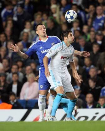 Chelsea s John Terry tussles with Marseilles Andre-Pierre Gignac - Champions League Group F - Chelsea FC (blue) v Olympique Marseille - 28th September, 2010 EDITORIAL USE ONLY. No use with unauthorised audio, video, data, fixture lists, club league logos or live services. Online in-match use limited to 120 images, no video emulation. No use in betting, games or single club league player publications.