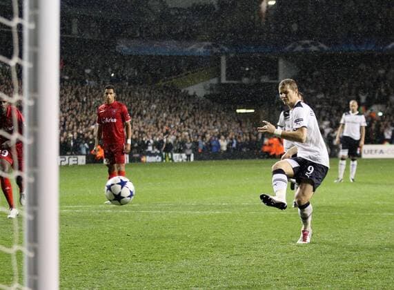 Tottenhams Roman Pavlyuchenko scoring his sides second goal - UEFA Champions League Group A: Tottenham Hotspur (white) v FC Twente Enschede - 29th September, 2010 - EDITORIAL USE ONLY. No use with unauthorised audio, video, data, fixture lists, club league logos or live services. Online in-match use limited to 120 images, no video emulation. No use in betting, games or single club league player publications.