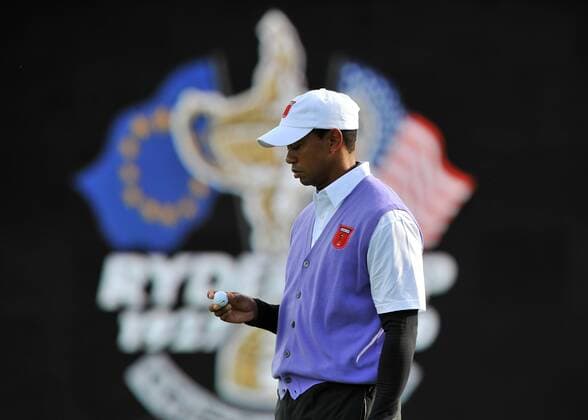 Golf - Ryder Cup 2010 - Day 1 Fourballs (day 2) Tiger Woods of the USA inspects his ball on the 16th green at Celtic Manor, Newport 