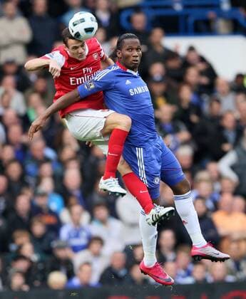 Chelseas Didier Drogba (R) tussles with Arsenals Sebastian Squillaci - Chelsea FC London - Arsenal FC London - EDITORIAL USE ONLY. No use with unauthorised audio, video, data, fixture lists, club league logos or live services. Online in-match use limited to 120 images, no video emulation. No use in betting, games or single club league player publications.